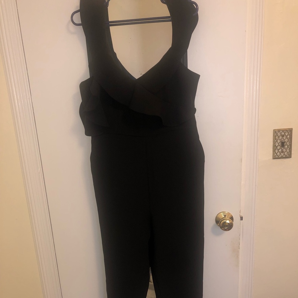 Black jumpsuit.I love it, it would look great on any body type. Doesn’t fit me